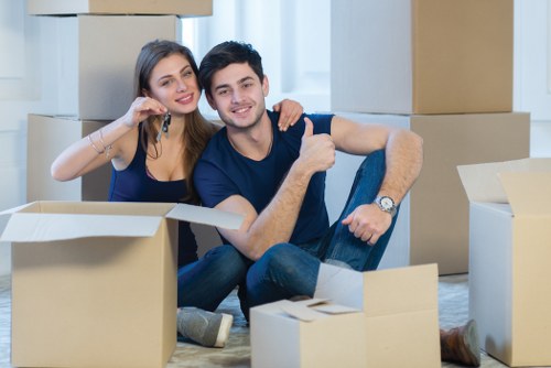 Removal team preparing a Brixton home move with boxes and furniture