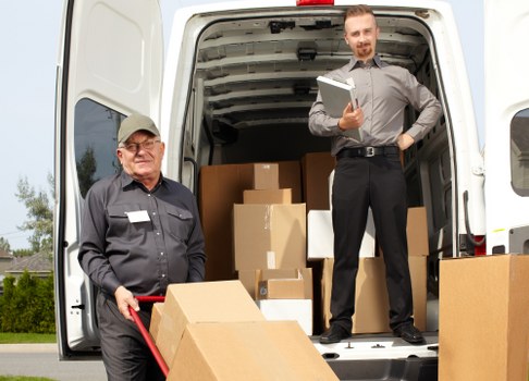 Loading household items into a van for a Brixton move