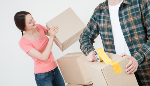 Checklist and packed office boxes ready for a Brixton business move